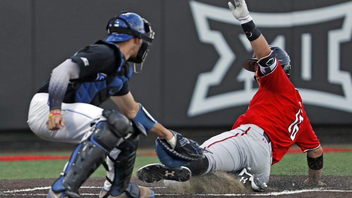 Duke's Chris Proctor (23) tags out Texas Tech's Josh Jung (16) as he slides into home plate during an NCAA college baseball tournament super regional game Sunday, June 10, 2018, in Lubbock, Texas.