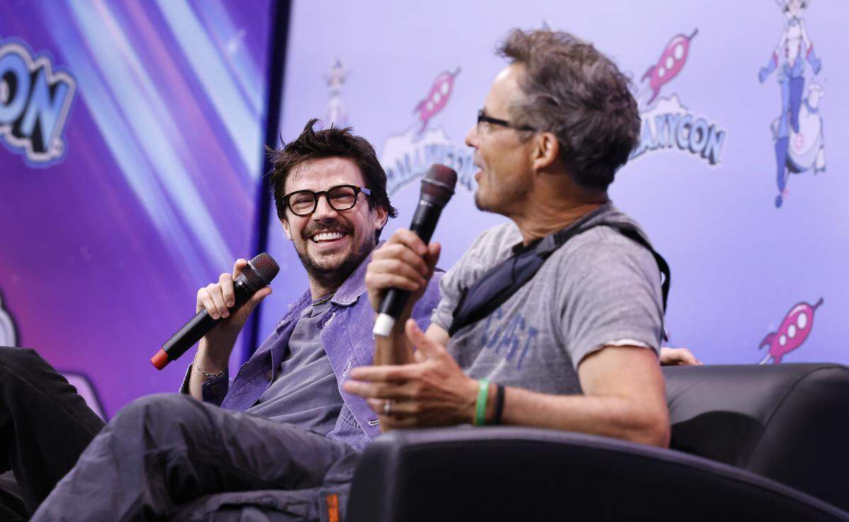 Grant Gustin, left, laughs with Tom Cavanagh during The Flash Q&A during GalaxyCon Raleigh at the Raleigh Convention Center Saturday, July 26, 2025.