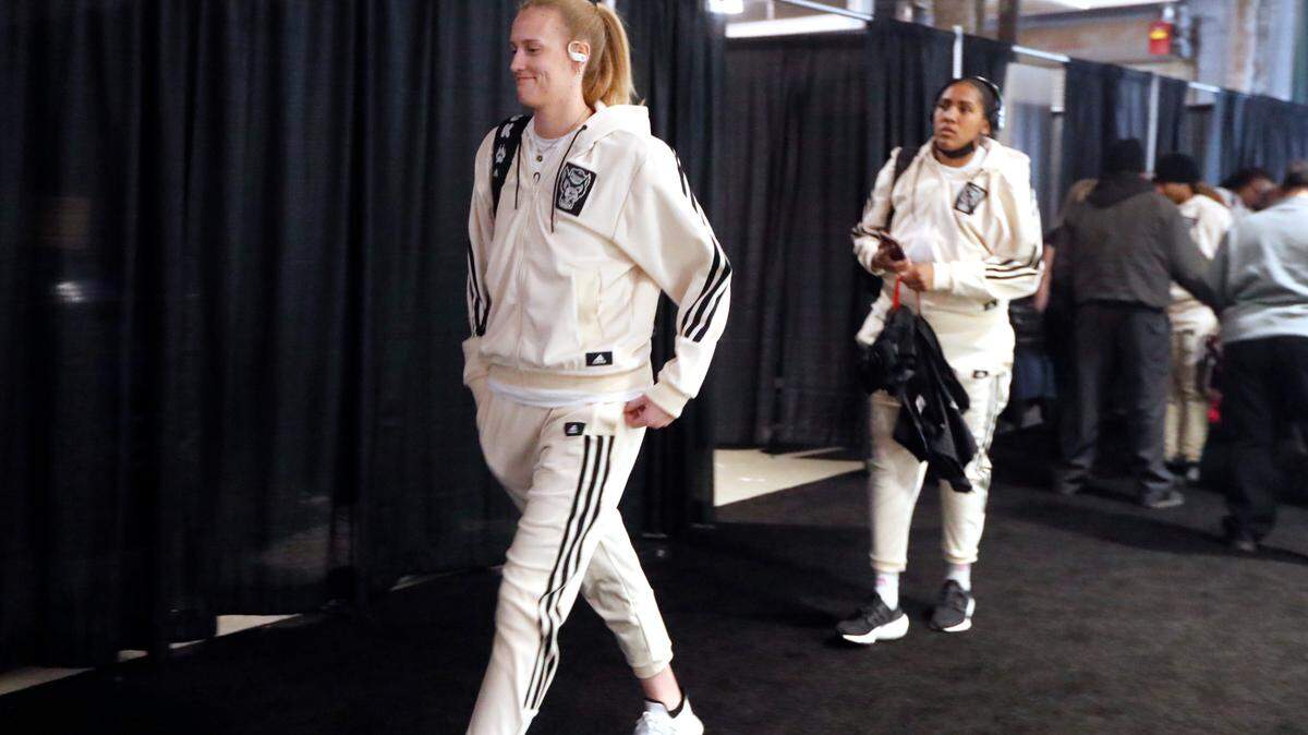 N.C. State’s Elissa Cunane and Camille Hobby head to the locker room after arriving at Total Mortgage Arena before N.C. State’s game against the University of Connecticut in the Bridgeport Regional final Monday, March 28, 2022.