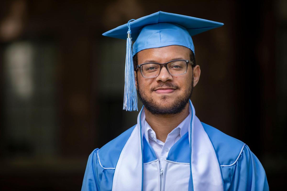 Oreyane Tate, 22, stands for a portrait in the cap and gown he wouldÕve worn to his graduation ceremony to celebrate earning his degree in communication studies at UNC Chapel Hill, on Wednesday, May 6, 2020, in Raleigh, N.C.