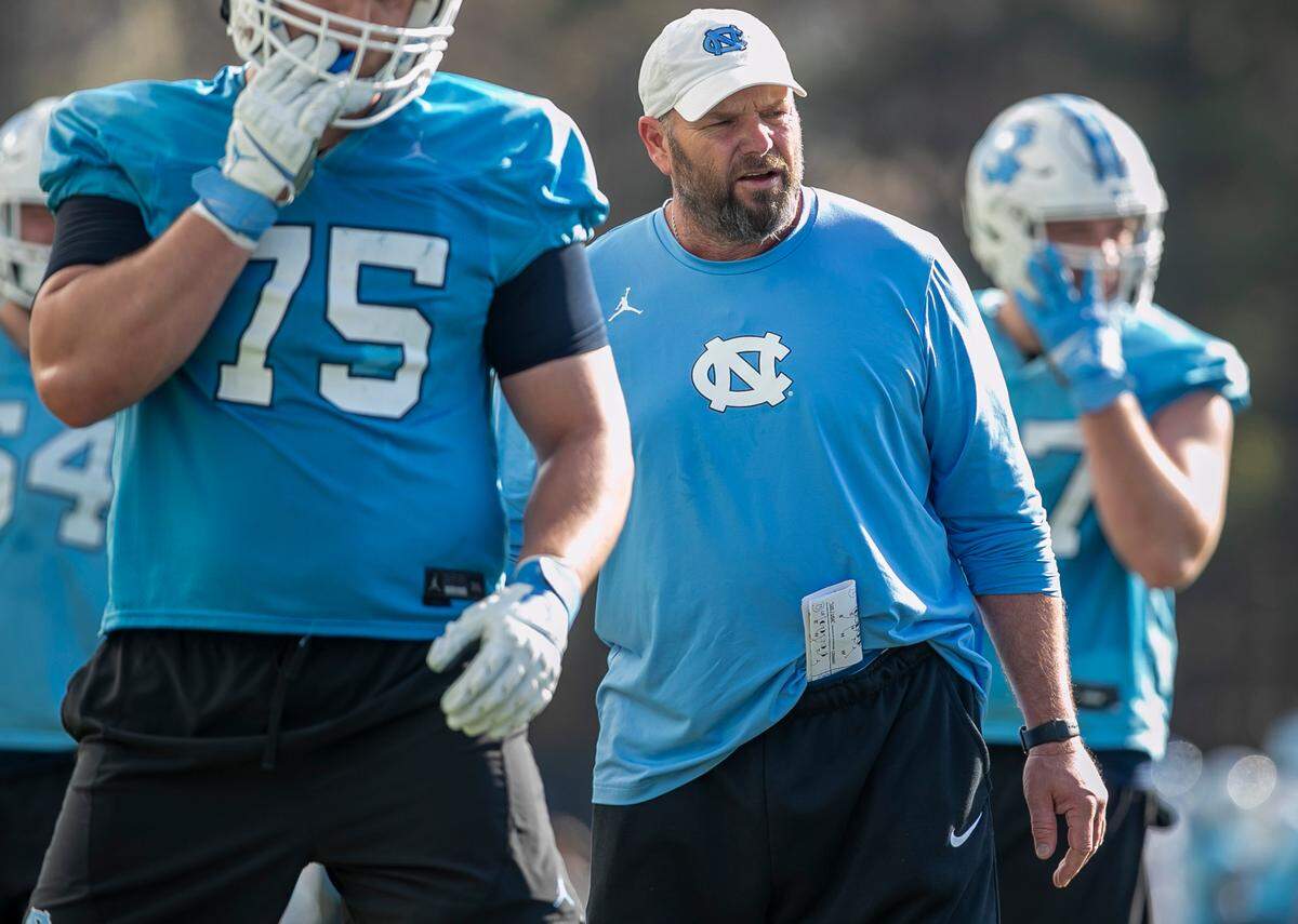North Carolina offensive line coach Randy Clements works with his players during the Tar Heels’ practice on Tuesday, March 7, 2023 in Chapel Hill, N.C.