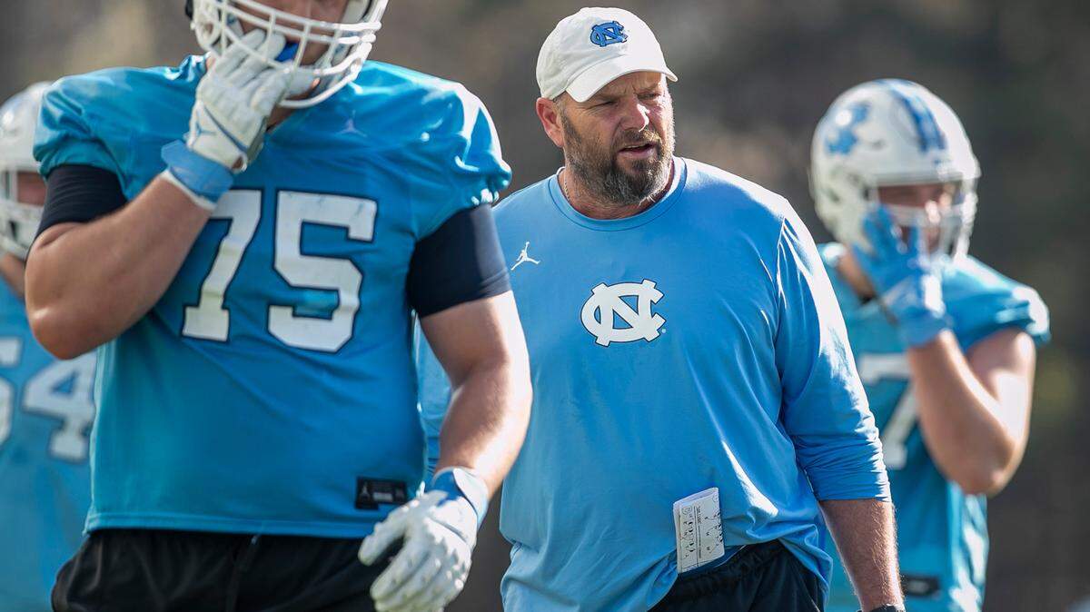 North Carolina offensive line coach Randy Clements works with his players during the Tar Heels’ practice on Tuesday, March 7, 2023 in Chapel Hill, N.C.