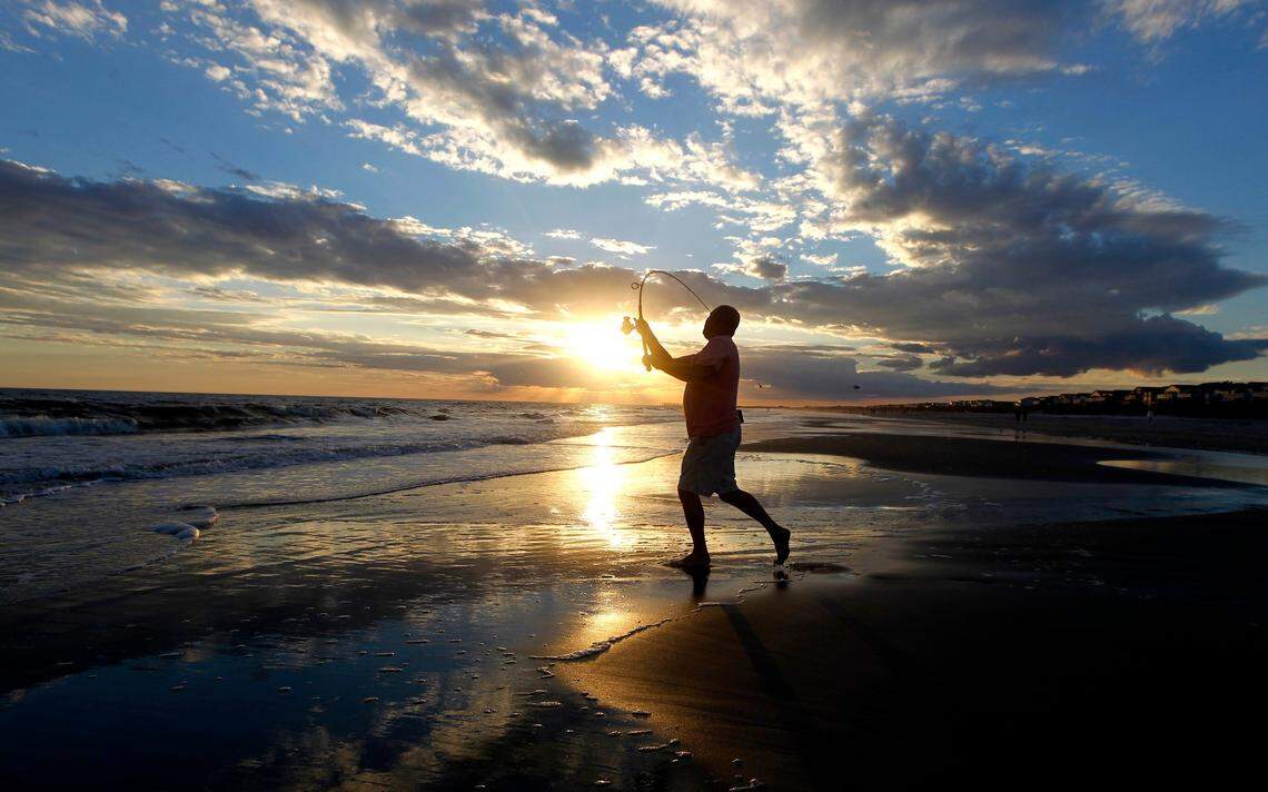 Gary Speed fishes from the beach at Sunset Beach, N.C.