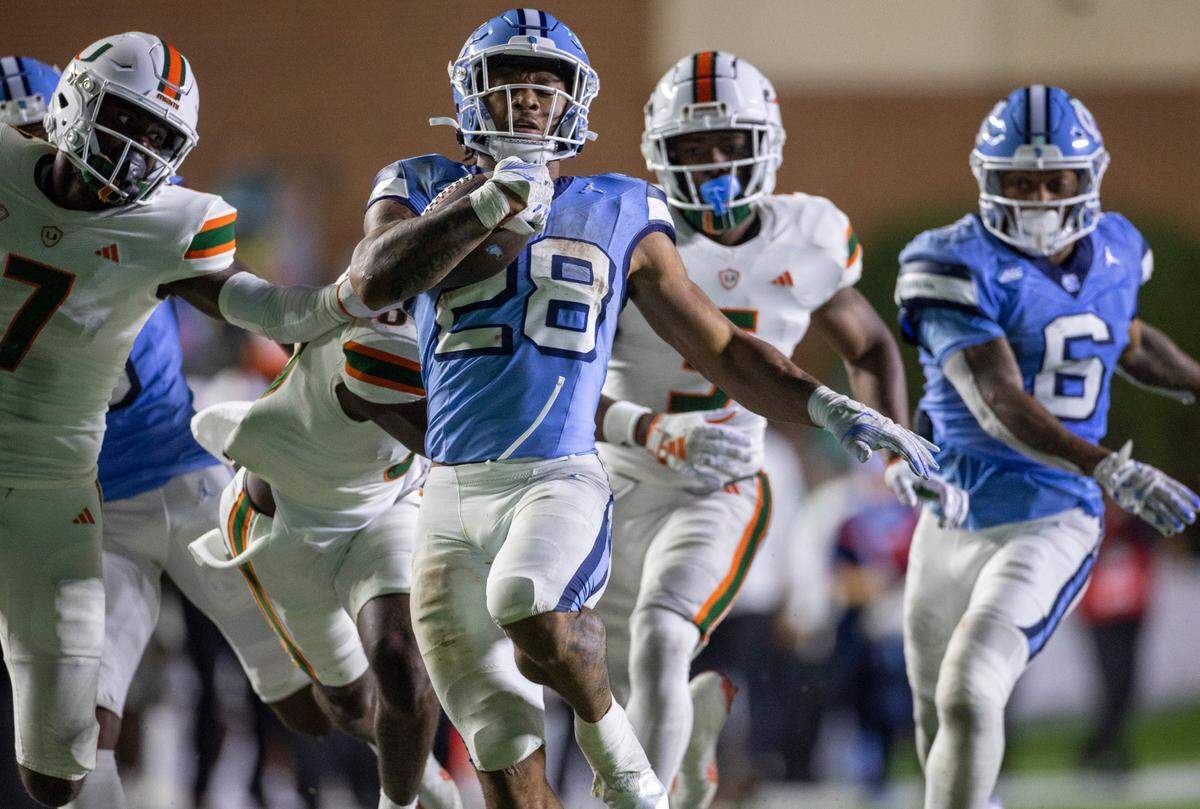 North Carolina running back Omarion Hampton (28) romps for 60-yards in the fourth quarter against Miami on Saturday, October 14, 2023 at Kenan Stadium in Chapel Hill, N.C. Hampton rushed for 197 yards and one touchdown in the Tar Heels’ 41-31 victory.