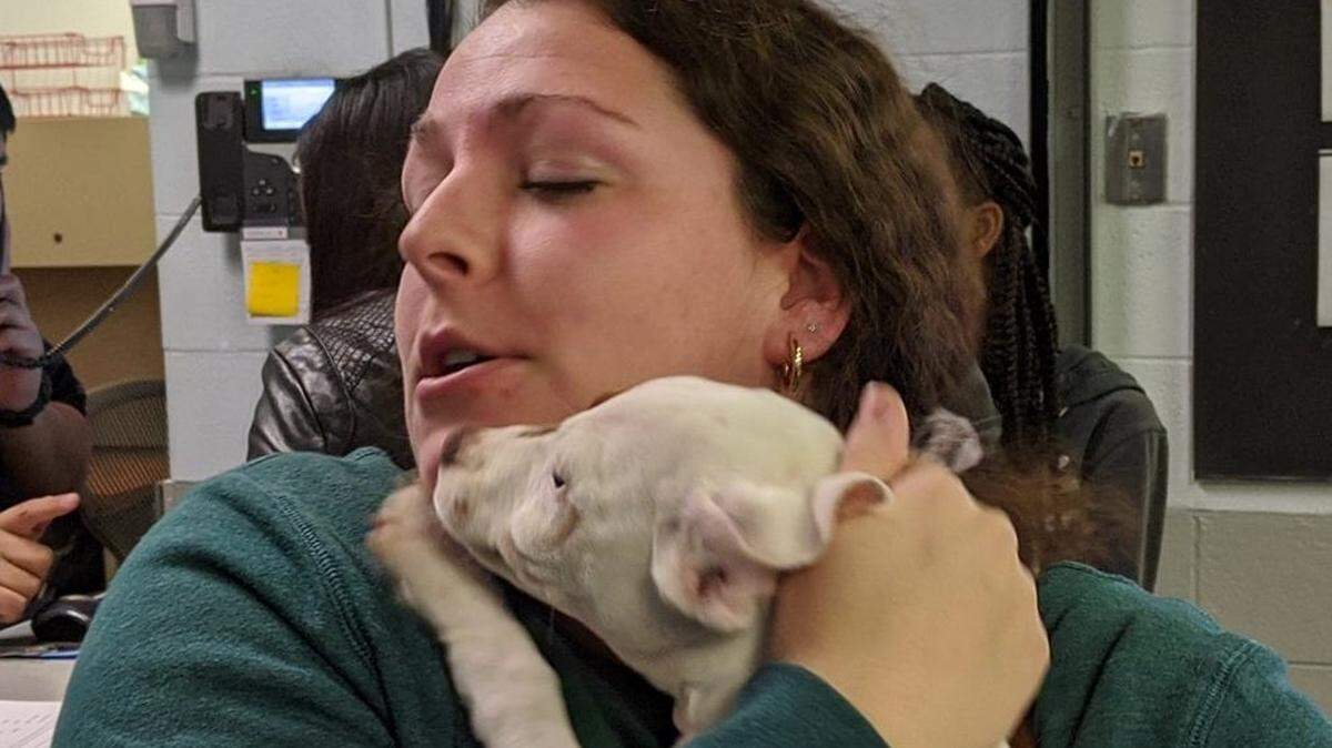 “Sadie Mae” accepts a hug from Faith Cicero as she prepares to adopted the dog from the Charlotte-Mecklenburg Police Department’s Animal Services shelter. State inspectors in North Carolina routinely check on the compliance of both governmental and private shelters with animal welfare laws.