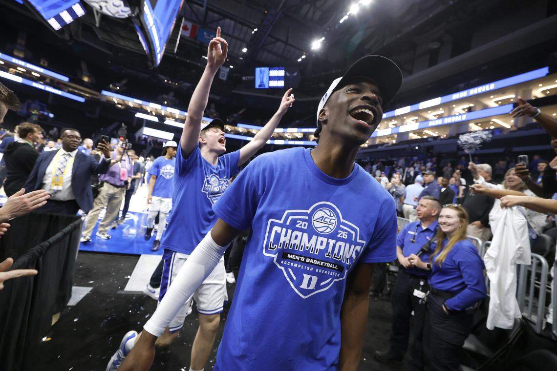 Duke’s Dame Sarr, right, and Nikolas Khamenia celebrate as they come off the floor after Duke’s 74-70 victory over Virginia in the finals of the 2026 ACC Men’s Basketball Tournament at the Spectrum Center in Charlotte, North Carolina, on Saturday, March 14, 2026.