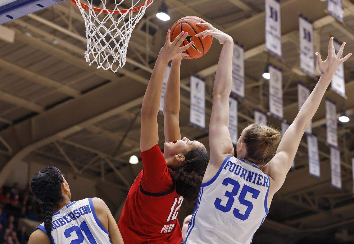 Duke’s Toby Fournier blocks a shot by N.C. State’s Khamil Pierre during the first half of the Blue Devils’ game on Thursday, Feb. 19, 2026, at Cameron Indoor Stadium in Durham, N.C.