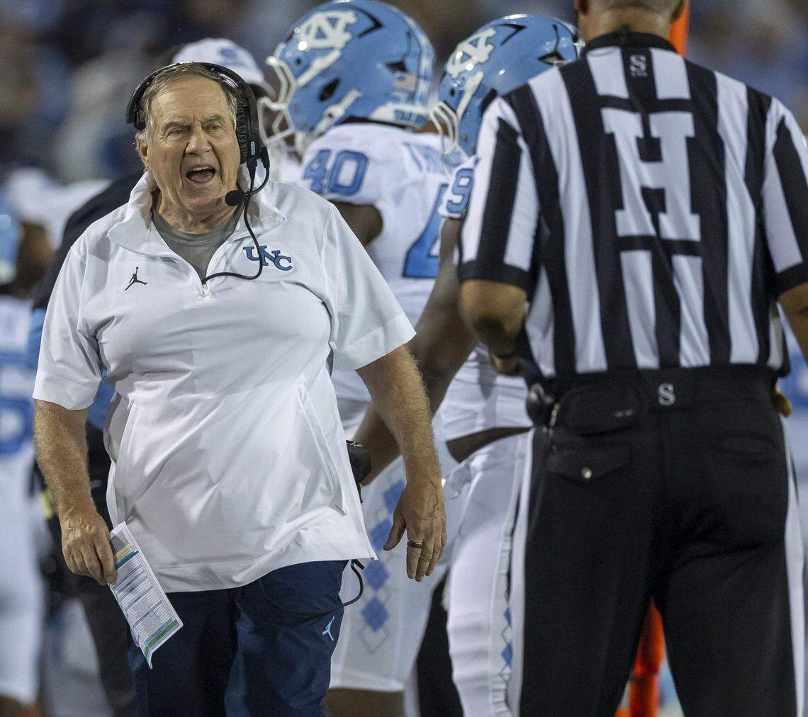North Carolina coach Bill Belichick questions a call with official Darryl Johnson in the third quarter against UNC Charlotte on Saturday, September 6, 2025 at Jerry Richardson Stadium in Charlotte, N.C. 