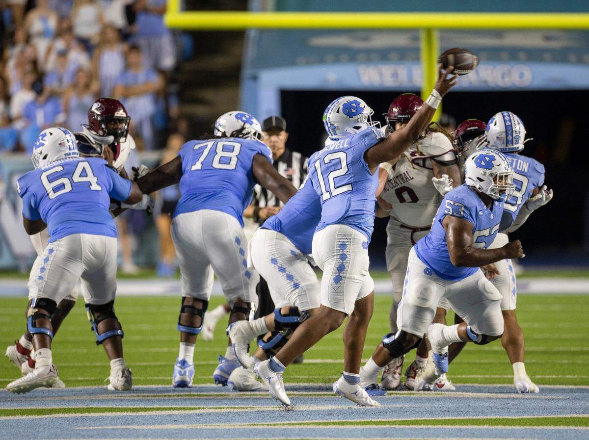 North Carolina quarterback Jacolby Criswell (12) looks for a receiver in the third quarter against N.C. Central on Saturday, September 14, 2024 at Kenan Stadium in Chapel Hill, N.C. Criswell was put into the game replacing starter Conner Harrell. Criswell passed for 161 yards and one touchdown.