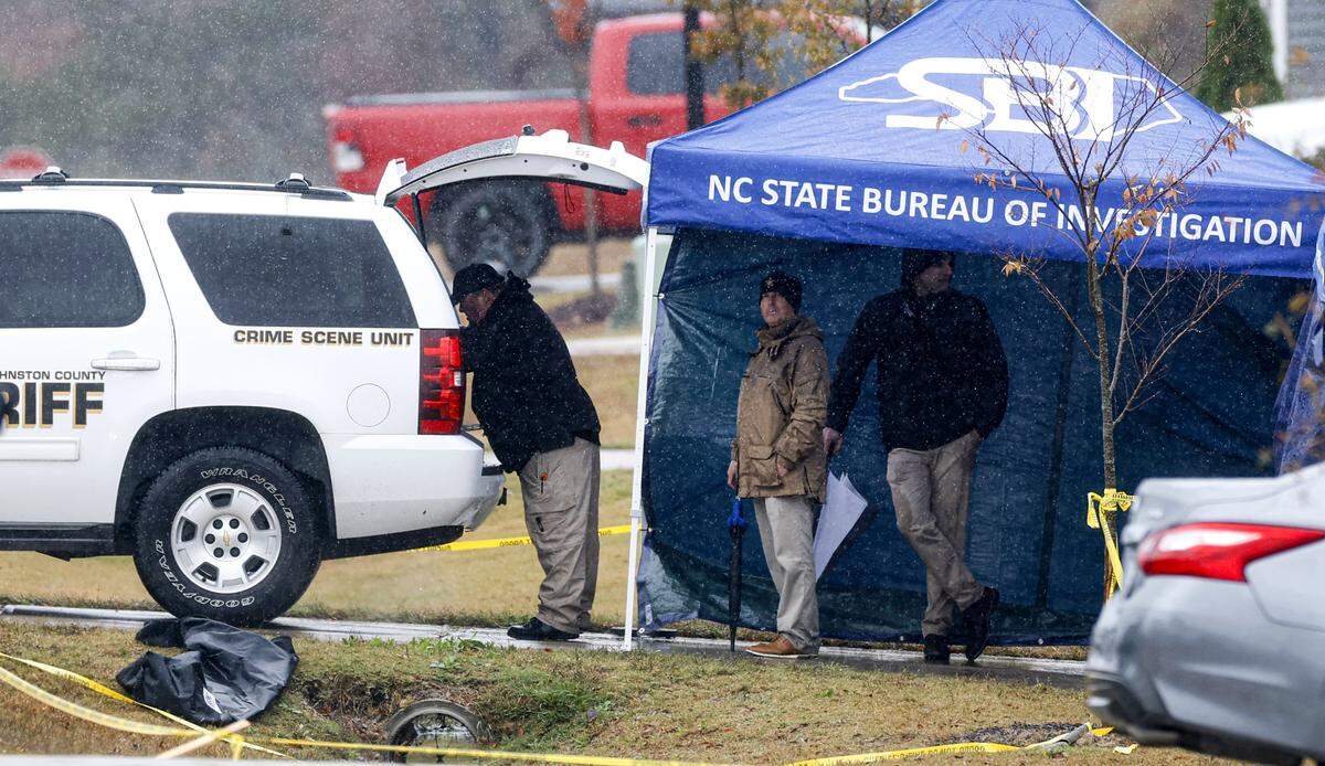 Investigators work at a home on Springtooth Drive in Zebulon, N.C., on Tuesday, Oct. 28, 2025.