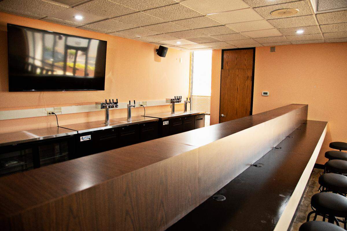 Ancillary Fermentation’s bar is the former teller station in the former bank in Raleigh.