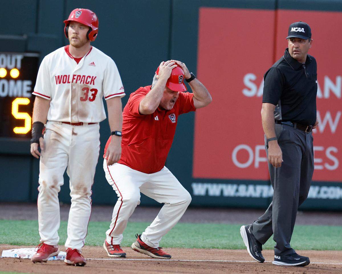 N.C. State associate head coach Chris Hart can’t believe the call by third base umpire Kevin Elzey in the seventh inning during N.C. State’s 6-4 victory over South Carolina in the NCAA Raleigh Regional at Doak Field Saturday, June 1, 2024.