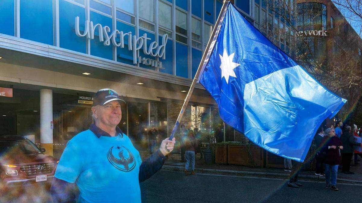 Mac Kendall, of Durham, waves the flag of Minnesota as he participates in the No Kings protest in Durham, N.C., Saturday, March 28, 2026. Kendall, a former resident of the state, was inspired by the example Minneapolis residents set by protesting the ICE operation in January.