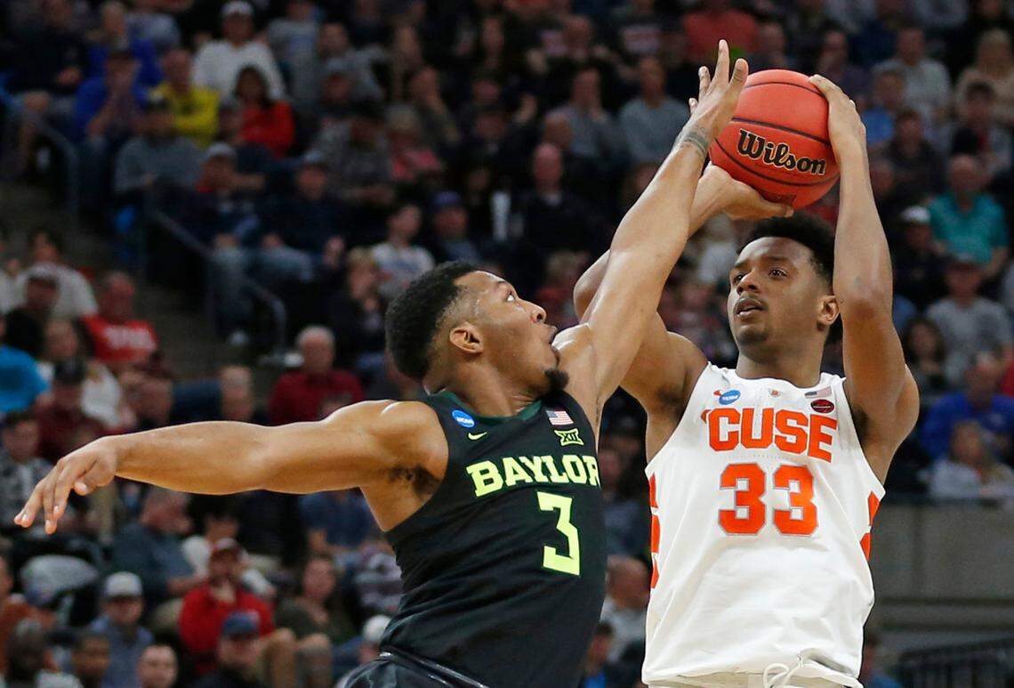 Syracuse forward Elijah Hughes (33) shoots as Baylor guard King McClure (3) defends during the first half of a first-round game in the NCAA men‚Äôs college basketball tournament Thursday, March 21, 2019, in Salt Lake City.