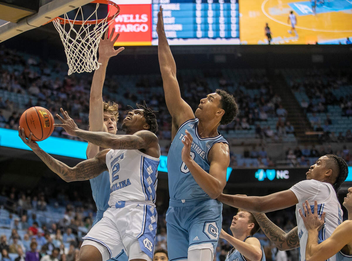 North Carolina’s Caleb Love (2) puts up a shot against The Citadel’s Jackson Price (0) in the first half on Tuesday, December 13, 2022 at the Smith Center in Chapel Hill, N.C.