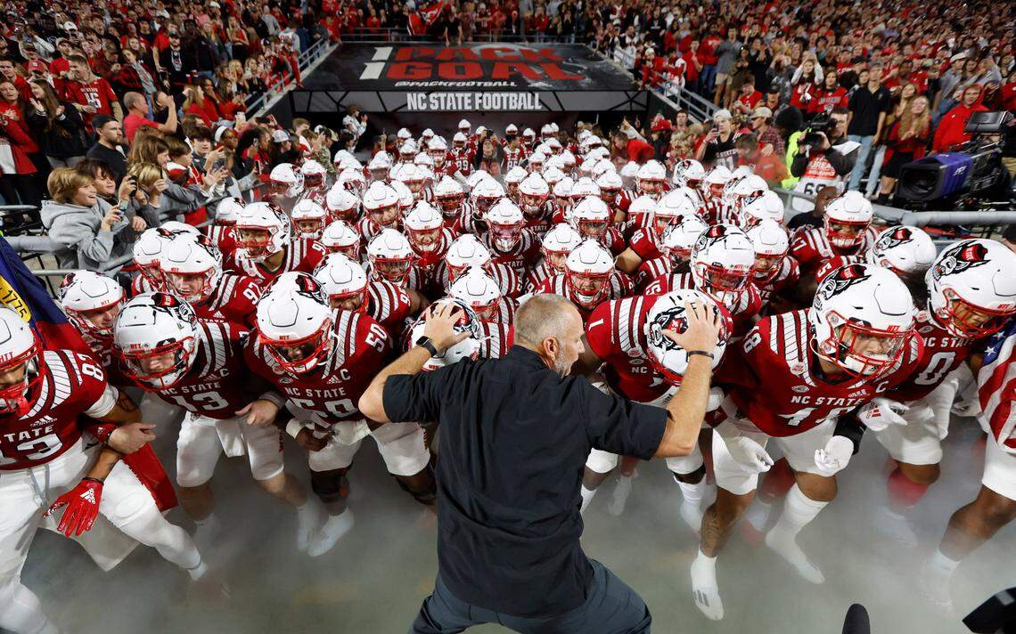 N.C. State head coach Dave Doeren leads his team onto the field before N.C. State’s game against Florida State at Carter-Finley Stadium in Raleigh, N.C., Saturday, Oct. 8, 2022.