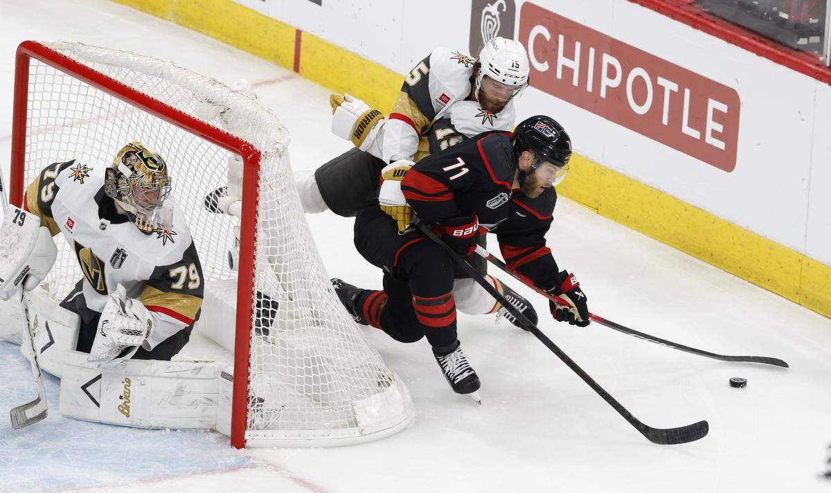 Carolina's Taylor Hall (71) keeps control of the puck as Vegas’ Noah Hanifin (15) pressures him in the second period of the Hurricanes’ game against the Golden Knights in the second game of the Stanley Cup Final at the Lenovo Center in Raleigh, N.C., Thursday, June 4, 2026.