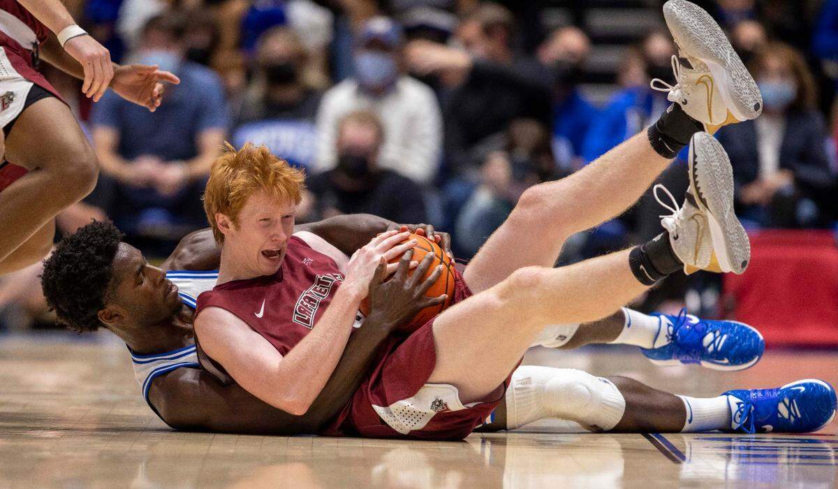 Duke’s A.J. Griffin (21) battles with Lafayette’s Leo O’Boyle (33) for a loose ball in the second half on Friday, November 19, 2021 at Cameron Indoor Stadium in Durham, N.C.