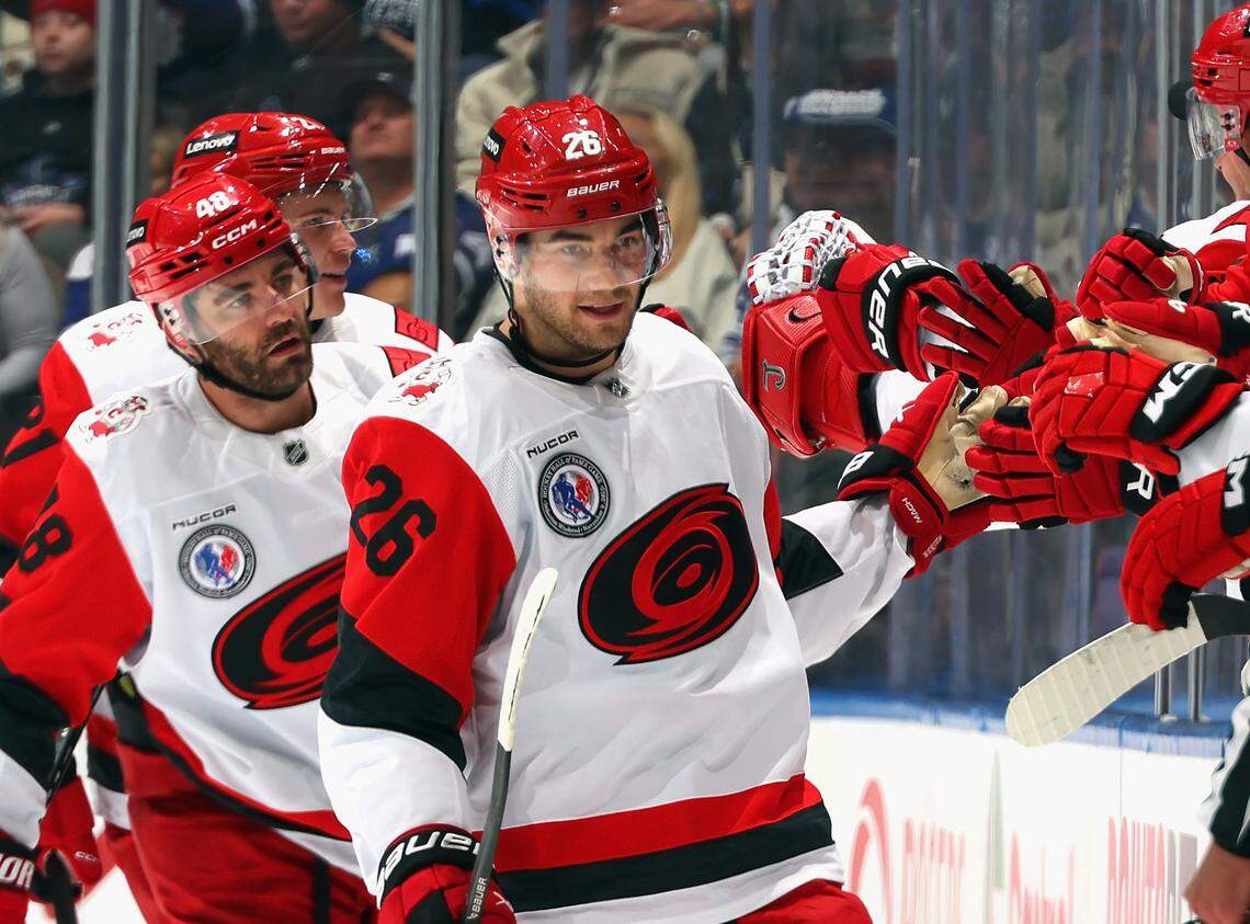 Sean Walker (26) of the Carolina Hurricanes celebrates his second-period goal against the Toronto Maple Leafs at Scotiabank Arena on Nov. 9, 2025 in Toronto, Ontario, Canada.
