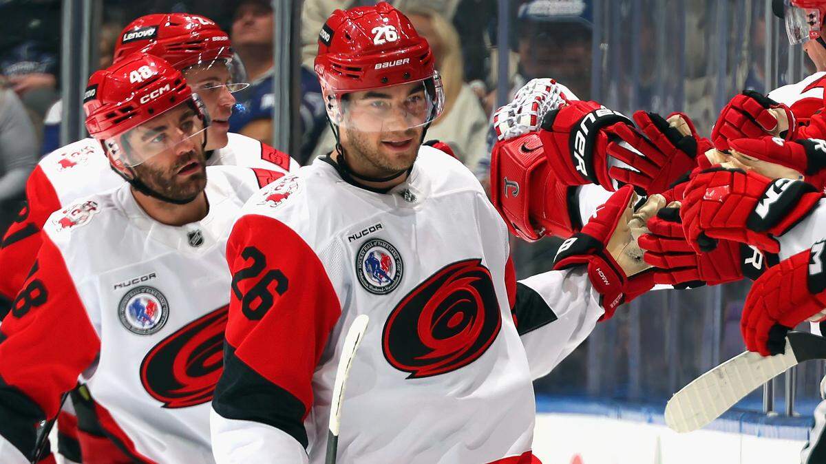 Sean Walker (26) of the Carolina Hurricanes celebrates his second-period goal against the Toronto Maple Leafs at Scotiabank Arena on Nov. 9, 2025 in Toronto, Ontario, Canada.