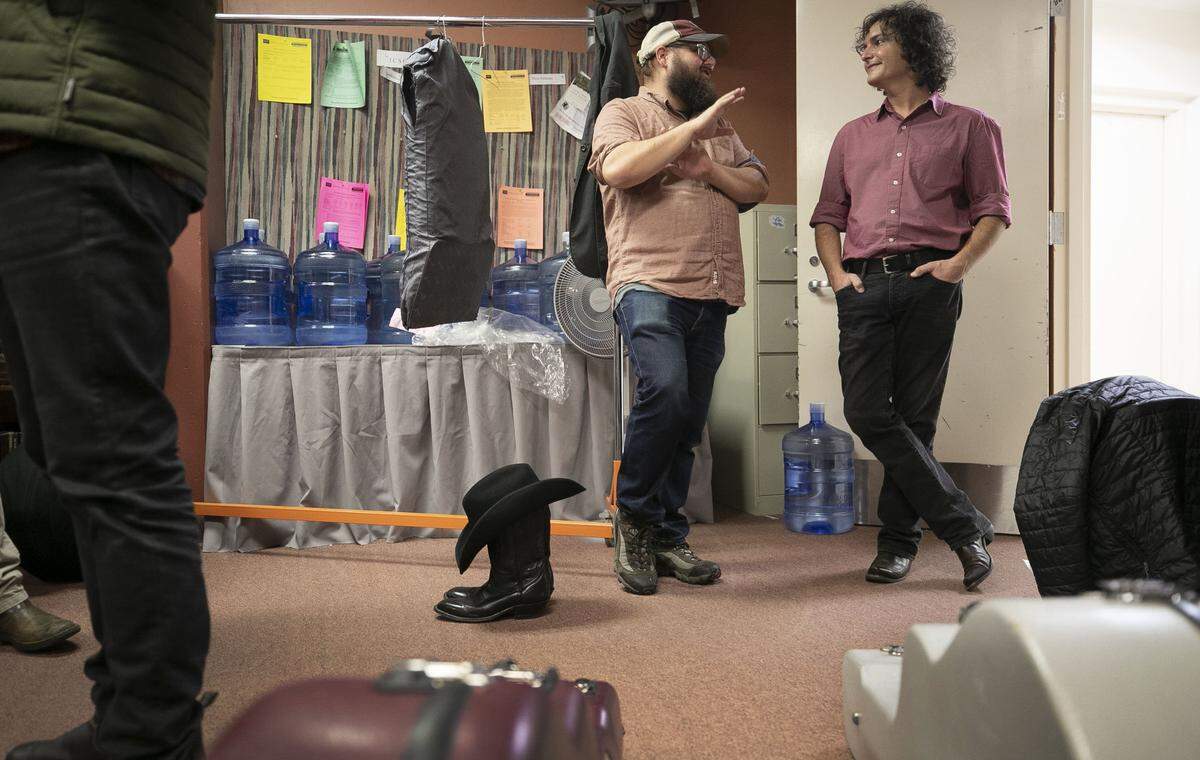 Williams Lewis the executive director of Pinecone, talks with Jimmy Rhine, the manager for Mandolin Orange and Andrew Marlin in the green room of Meymandi Concert Hall following Marlin’s performance on Thursday, November 15, 2018 in Raleigh, N.C.