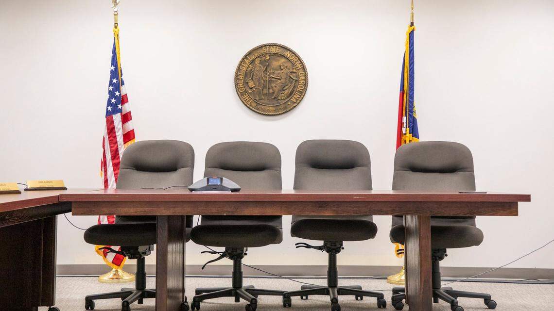 Chairs for members of the N.C. State Board of Election remain empty during a teleconference meeting announcing the appointment of the new executive director Karen Brinson Bell, replacing Kim Strach who oversaw the 9th district election fraud investigation, on Monday, May 13, 2019, in Raleigh, NC.
