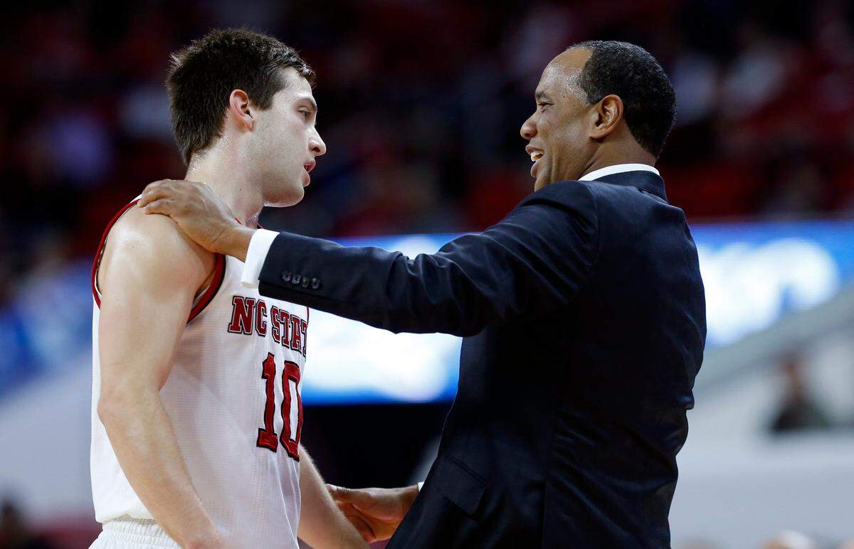 N.C. State head coach Kevin Keatts talks with Braxton Beverly (10) during the second half of N.C. State’s 86-68 victory over Presbyterian College at PNC Arena in Raleigh, N.C., Thursday, Nov. 16, 2017.