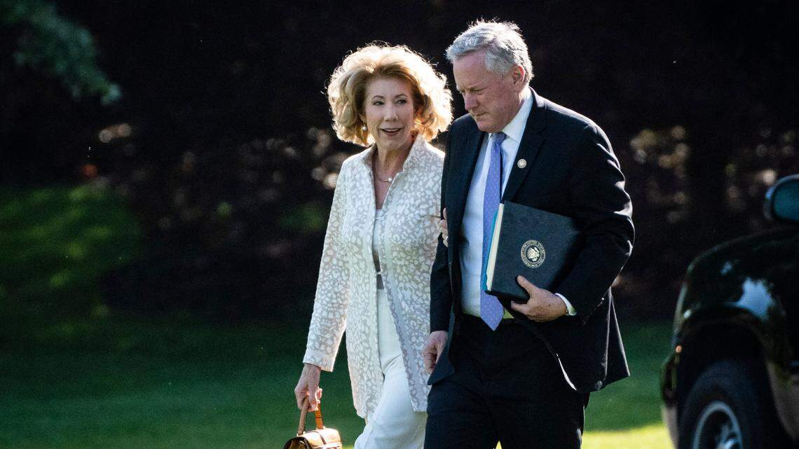 Then-White House Chief of Staff Mark Meadows and his wife, Debra Meadows, walk from the Oval Office to board Marine One and depart for Camp David on May 15, 2020.