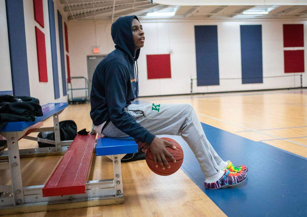Jyrah Canady, 17, a senior varsity basketball player at Kinston High School, rests after playing basketball with family and friends at the Kinston Community Center in Kinston, N.C. on Feb. 2, 2022.