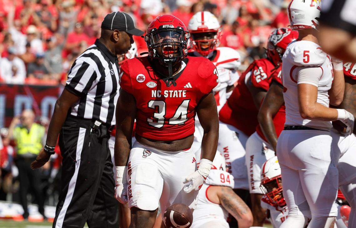 N.C. State running back Delbert Mimms III (34) celebrates after scoring on a one-yard touchdown run during the first half of N.C. State’s game against VMI at Carter-Finley Stadium in Raleigh, N.C., Saturday, Sept. 16, 2023.