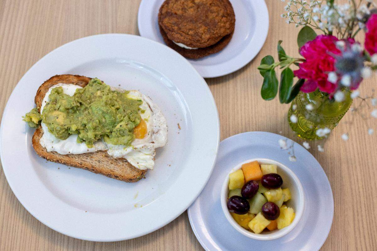 Avocado Toast, fruit and, cookie from, A Place at the Table Cafe, a pay-what-you-can restaurant at 300 W. Hargett Street in Raleigh on Wednesday, May 13, 2025.