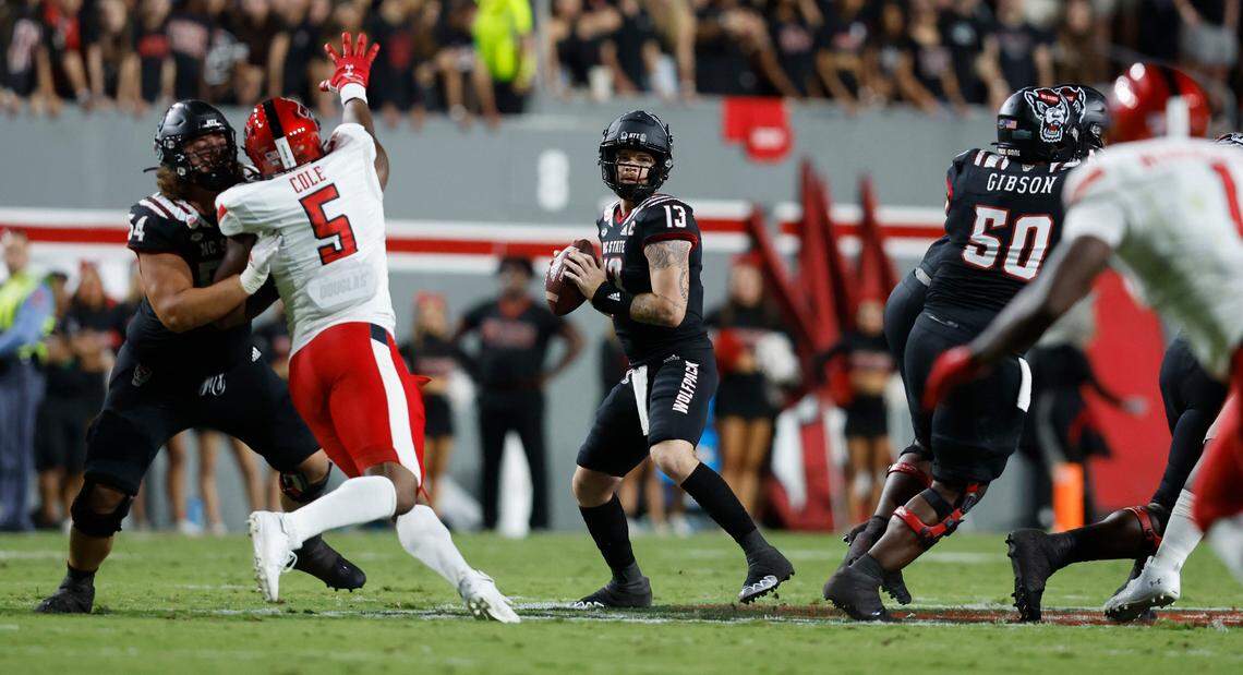 N.C. State quarterback Devin Leary (13) looks for receiver downfield during the first half of N.C. State’s game against Texas Tech at Carter-Finley Stadium in Raleigh, N.C., Saturday, Sept. 17, 2022.