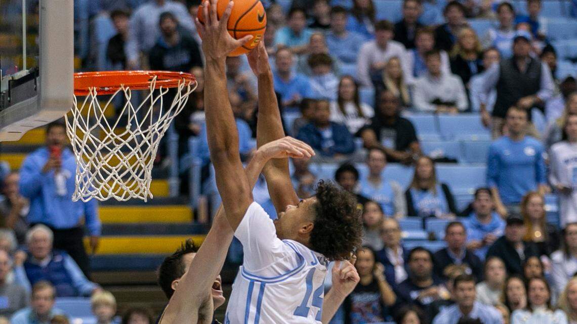 North Carolina’s Puff Johnson (14) dunks against Notre Dame’s Cormac Ryan (5) during the second half on Saturday, January 7, 2023 at the Smith Center in Chapel Hill, N.C.