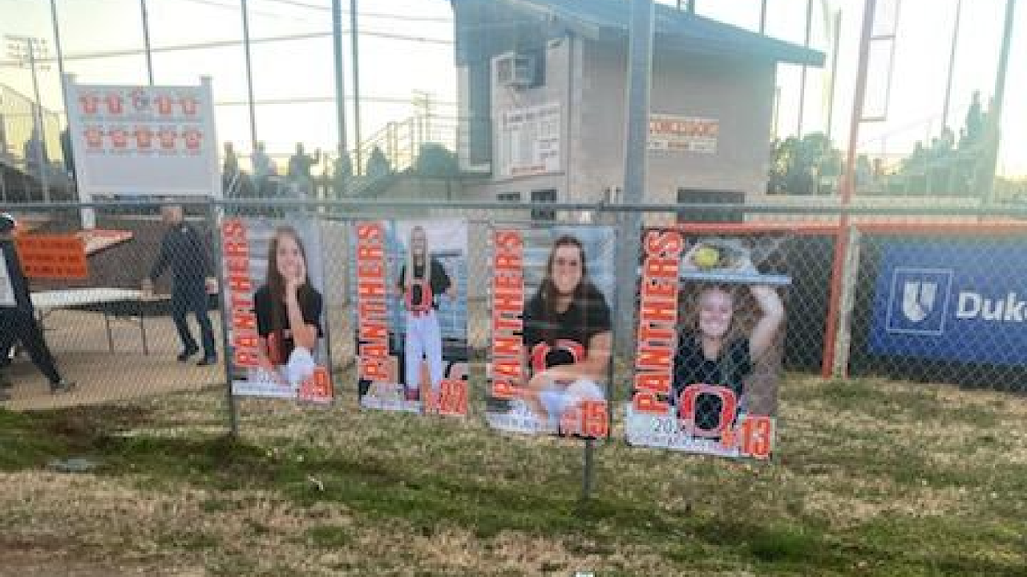 Four senior banners from Orange High School softball field.