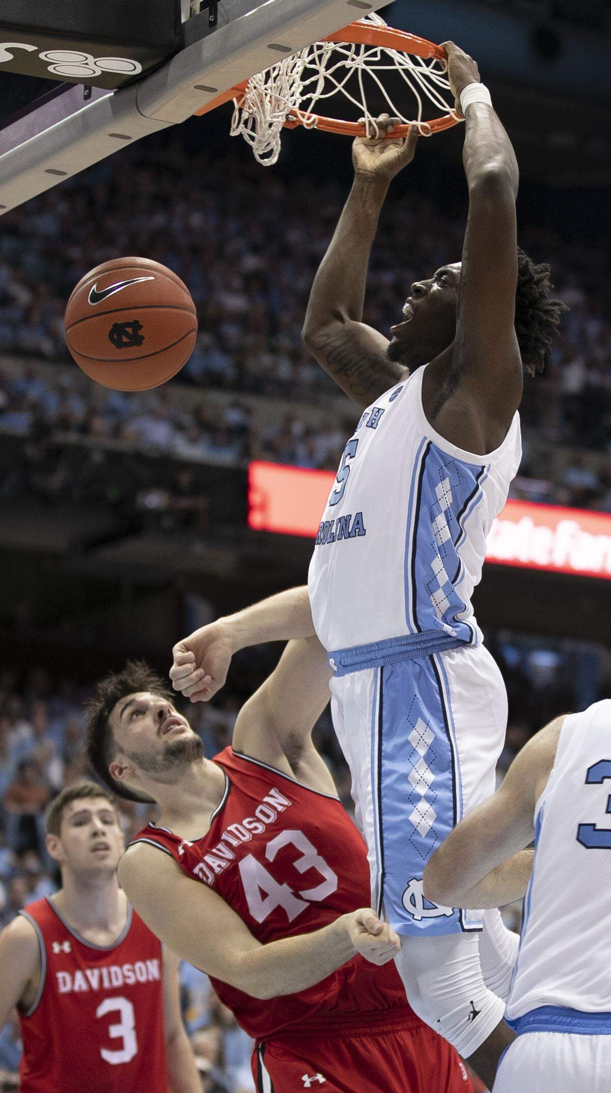 North Carolina’s Nassir Little (5) dunks over Davidson’s Dusan Kovacevic (43) in the first half on Saturday, December 29, 2018 at the Smith Center in Chapel Hill, N.C.