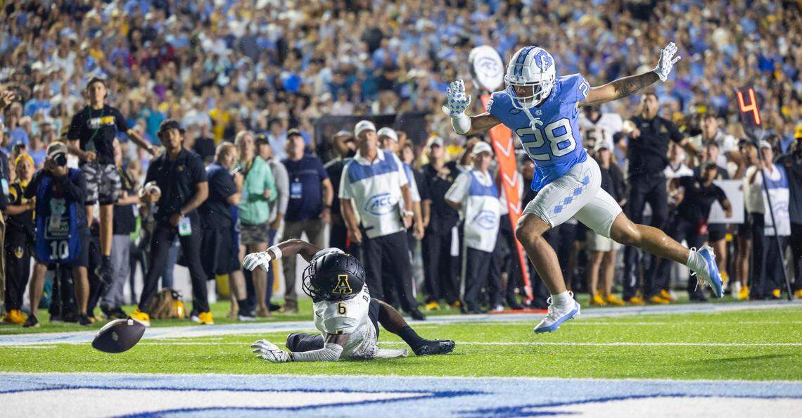 North Carolina’s Alijah Huzzie (28) defends Appalachian State’s Dashawn Davis (6) as he reaches for a pass from quarterback quarterback Joey Aguilar (4) on the final play in overtime on Saturday September 9, 2023 at Kenan Stadium in Chapel Hill, N.C. The pass was incomplete, securing the Tar Heels’ 40-34 overtime victory.