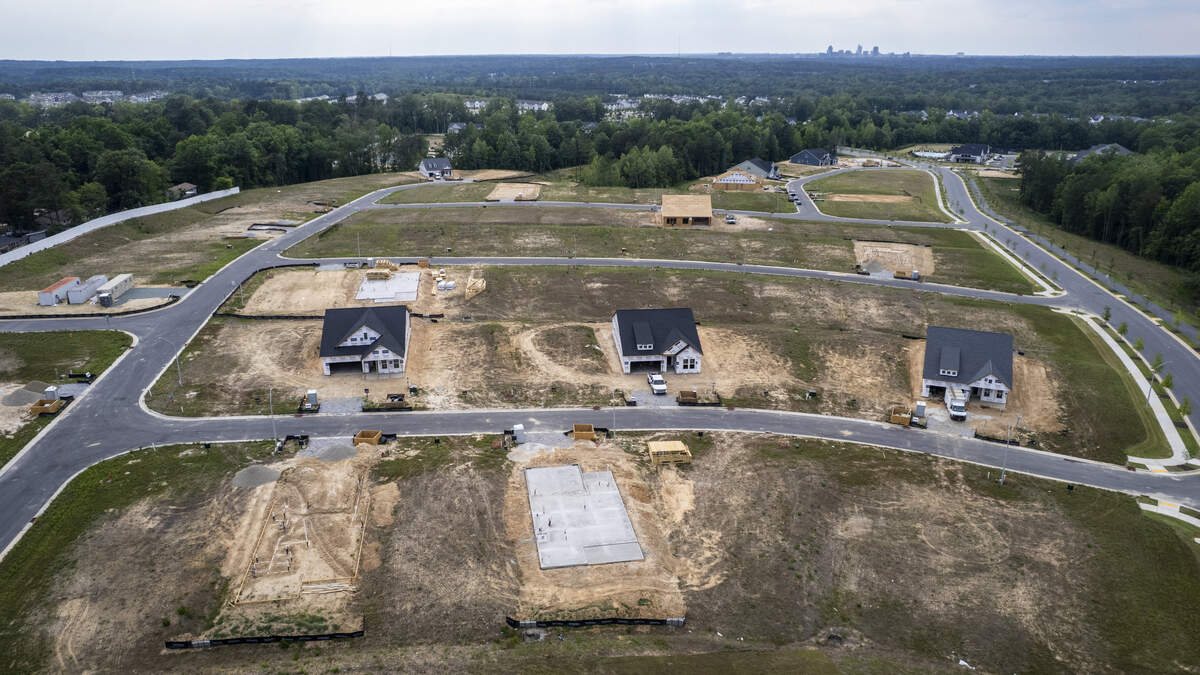 An aerial view of homes under construction Monday, June 8, 2026, at Regency at Olde Towne, a 55-plus community in Raleigh that the developer describes as featuring luxury homes.