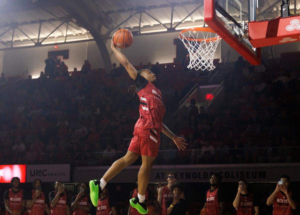 N.C. State’s Breon Pass competes in a dunk contest during the Primetime with the Pack preseason event on Friday, Oct. 25, 2024, at Reynolds Coliseum in Raleigh, N.C.