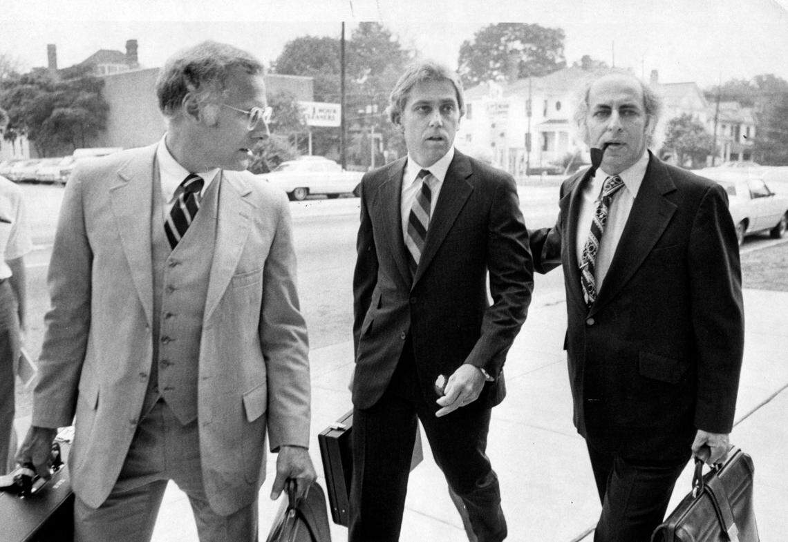 Dr. Jeffrey MacDonald (center) arrives at the US District Court in Raleigh, N.C. flanked by his lawyers Wade Smith (left) and Bernard Segal (right) July 17, 1979.