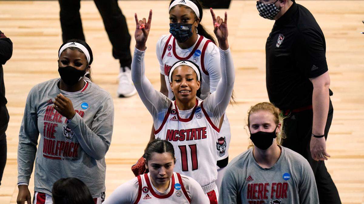 North Carolina State forward Jakia Brown-Turner (11) walks off the court with teammates after a college basketball game against South Florida in the second round of the women’s NCAA tournament at the Alamodome in San Antonio, Tuesday, March 23, 2021. North Carolina State won 79-67.
