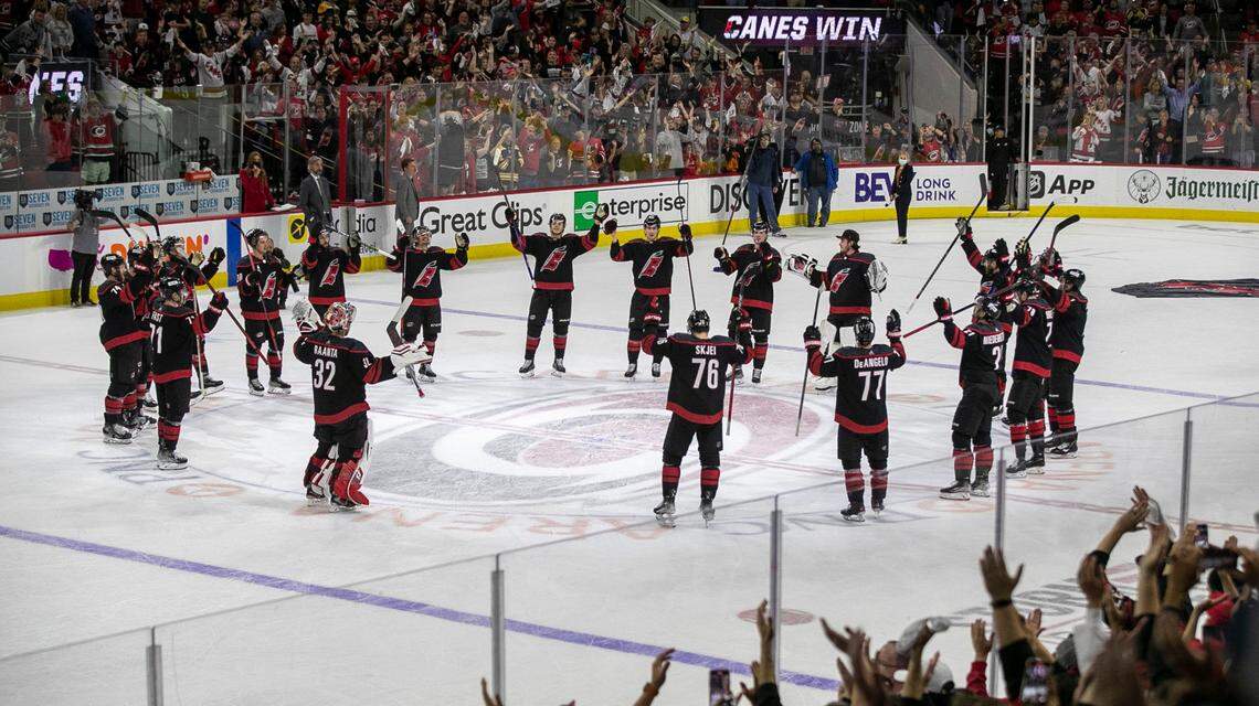 The Carolina Hurricanes celebrate their 3-2 victory over Boston after clinching the first round of their Stanley Cup series on Saturday, May 14, 2022 at PNC Arena in Raleigh, N.C.