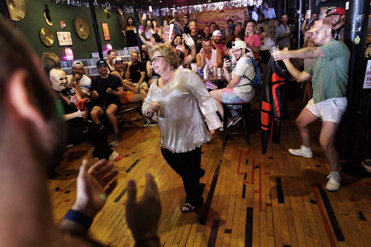 Mary Williams Cordell danced during karaoke at Neptunes Parlour at Out! Raleigh Pride Saturday.