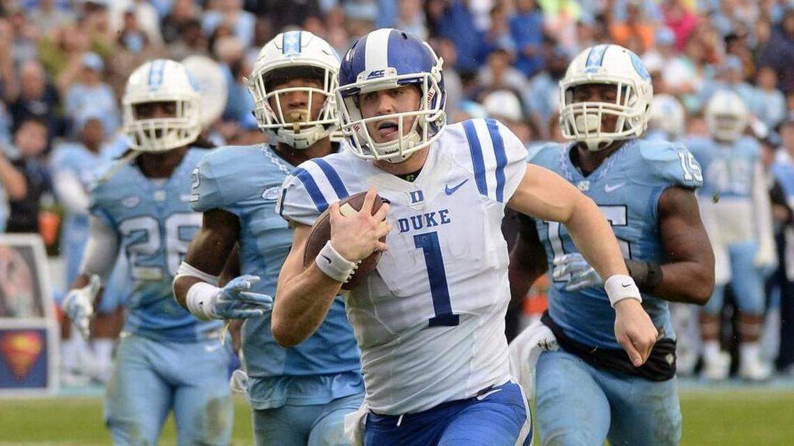 Former Duke quarterback Thomas Sirk (1) beats the UNC defense to score in November 2015.