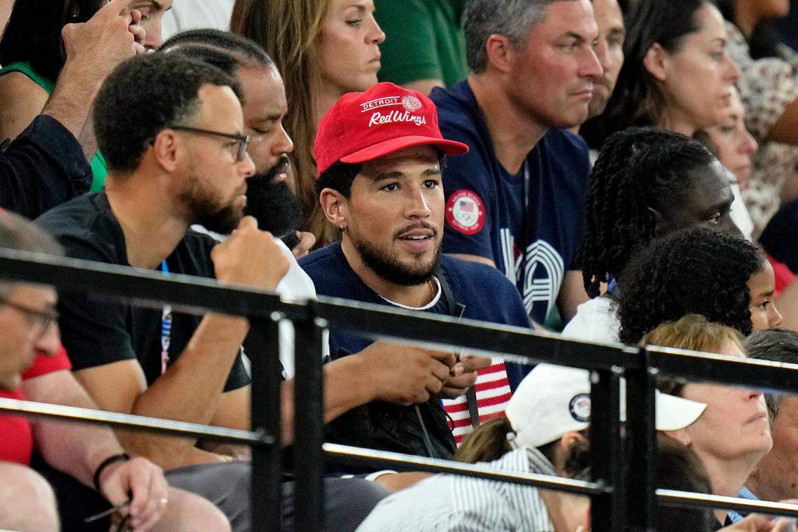 Aug 1, 2024; Paris, France; Devin Booker and Stephen Curry attend the women’s gymnastics all-around during the Paris 2024 Olympic Summer Games at Bercy Arena.
