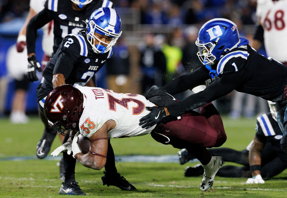 Duke’s Terry Moore tackles Virginia Tech’s Bhayshul Tuten during the first half of the Blue Devils’ 31-28 win on Saturday, Nov. 23, 2024, at Wallace Wade Stadium in Durham, N.C.