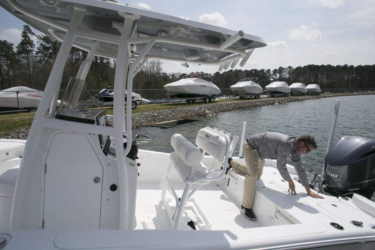 Chatlee Marine's Joey Seagroves, readies a Sea Hunt BX-25  to show a customer on the company's demonstration lake on Wednesday, March 28, 2018 in Sanford, N.C. Chatlee sees a spike in their business with the warming of temperatures in the Spring.