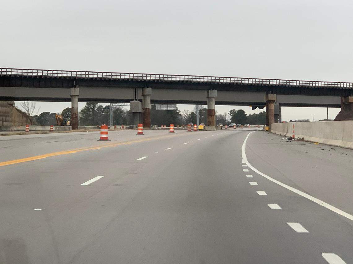 The piers for the temporary railroad bridge over U.S. 70 are preventing contractors from finishing the merge of U.S. 70 and the Durham East End Connector. CSX and Norfolk Southern railroads have used the bridge while two permanent ones, seen in the background, were built.