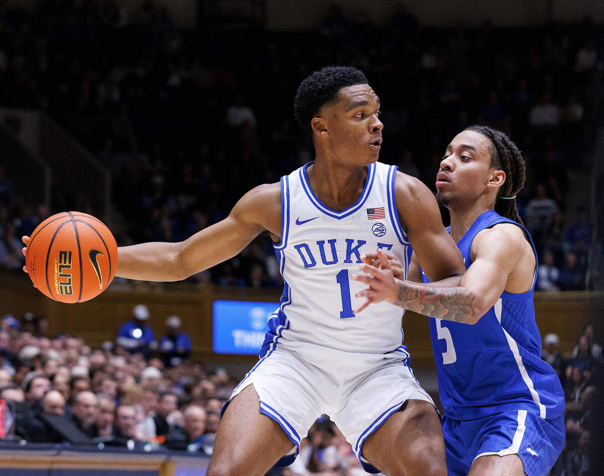 Duke’s Caleb Foster is pressured by Hofstra’s Jaquan Carlos during the first half of the Blue Devils’ game on Tuesday, Dec. 12, 2023, at Cameron Indoor Stadium in Durham, N.C.