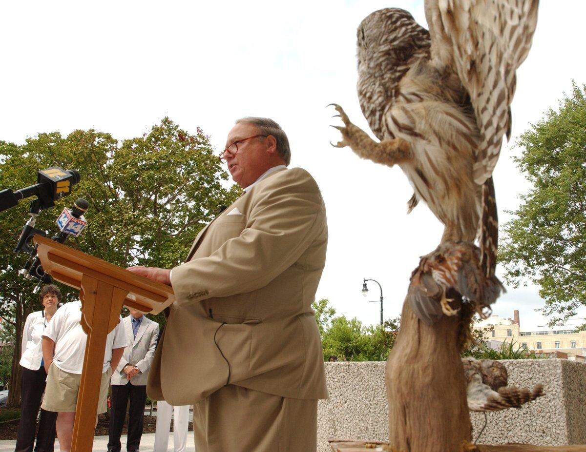 A stuffed Barred Owl display, right, seemed to menace Durham resident Larry Pollard during his press conference in front of the Durham County Courthouse in 2008. Pollard, a former neighbor of convicted murderer Michael Peterson was attempting to bolster his hypothesis that an owl killed Peterson’s wife, Kathleen Peterson, instead of Peterson. An SBI evidence report, says Pollard, mentions a microscopic feather along with some of her hair found in Kathleen Peterson’s hand at the time of her death in Dec., 2001. Pollard is seeking to have the case reopened on evidence of a possible owl attack outside of the Peterson home.