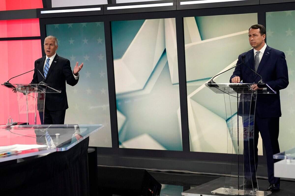 U.S. Sen. Thom Tillis, R-N.C. left, makes comments as Democratic challenger Cal Cunningham listens at right during a televised debate at WNCN-TV in Raleigh, N.C., Tuesday, Sept. 22, 2020.